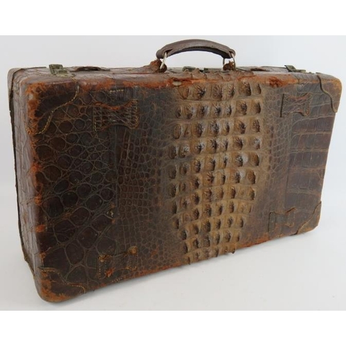 156 - A good quality vintage crocodile skin suitcase with full pigskin lining, internal straps and brass f... 