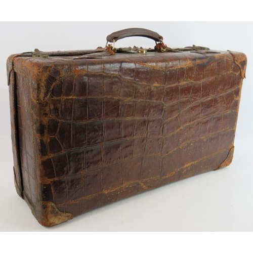 156 - A good quality vintage crocodile skin suitcase with full pigskin lining, internal straps and brass f... 