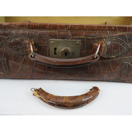 156 - A good quality vintage crocodile skin suitcase with full pigskin lining, internal straps and brass f... 