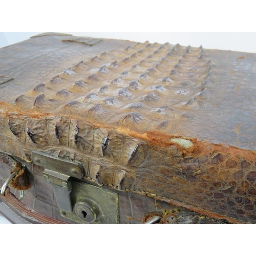 156 - A good quality vintage crocodile skin suitcase with full pigskin lining, internal straps and brass f... 