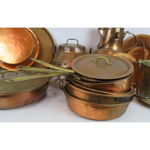 157 - A large quantity of good quality copper and brass cooking pans and jugs, 15 different items in total... 