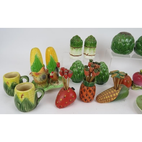 159 - A collection of mainly Majolica style cruet sets in the form of vegetables, plus three cocktail stic... 