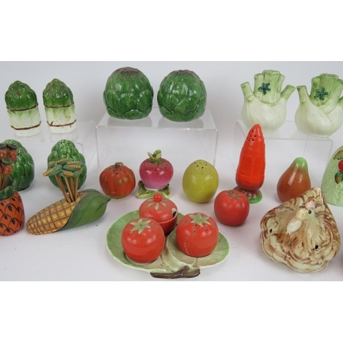 159 - A collection of mainly Majolica style cruet sets in the form of vegetables, plus three cocktail stic... 