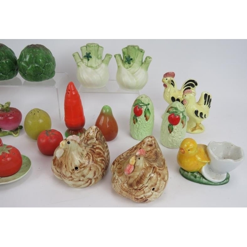 159 - A collection of mainly Majolica style cruet sets in the form of vegetables, plus three cocktail stic... 