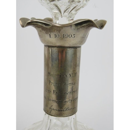 166 - A German white metal mounted decanter with inscription to Prince Heinrich XLII, dated 1909, plus two... 