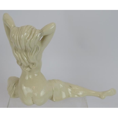 168 - A vintage porcelain figure of a reclining nude in the Art Deco style, incised marks to base (illegib... 