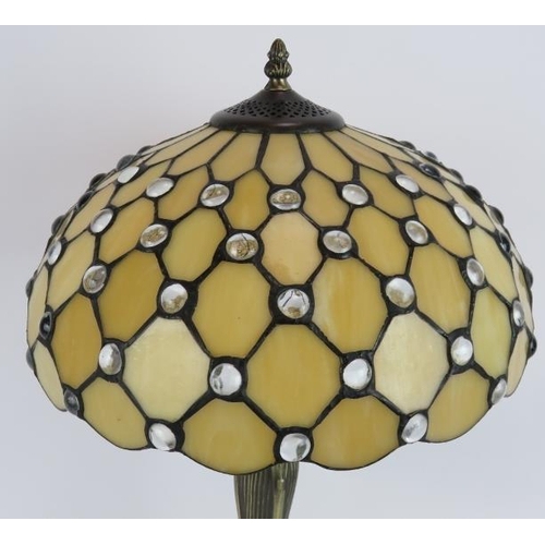 169 - A contemporary Tiffany style lamp and shade with bronzed lotus leaf base and stained glass shade. He... 