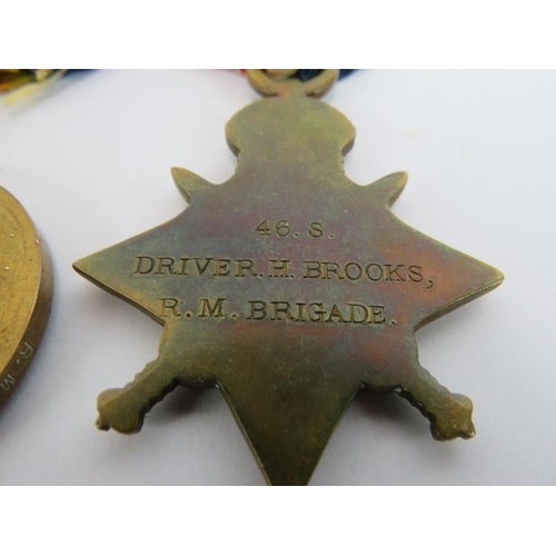 17 - A WWI trio medal group engraved to 46.S Driver H Brooks R.M Brigade plus photo, discharge papers, Ro... 