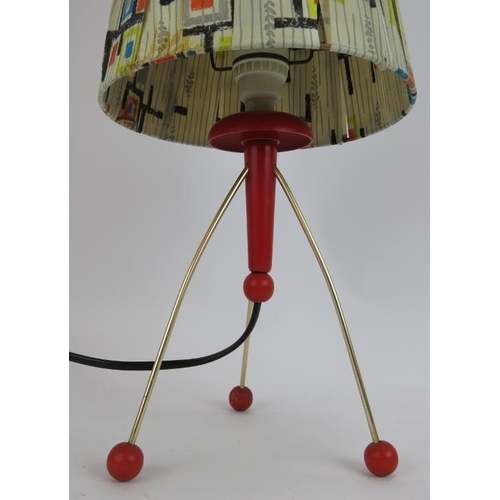 172 - A rare 1950s atomic tripod lamp gold coloured legs on red ball feet and red body and original abstra... 