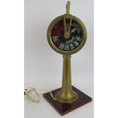 175 - A vintage brass ship's engine room telegraph control lamp with working controls and bell, mounted on... 