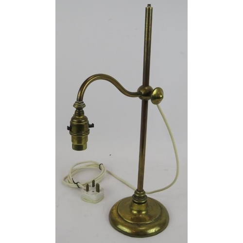 177 - An early antique brass rise and fall desk lamp with filled lead base. Height 45cm.
Condition report:... 