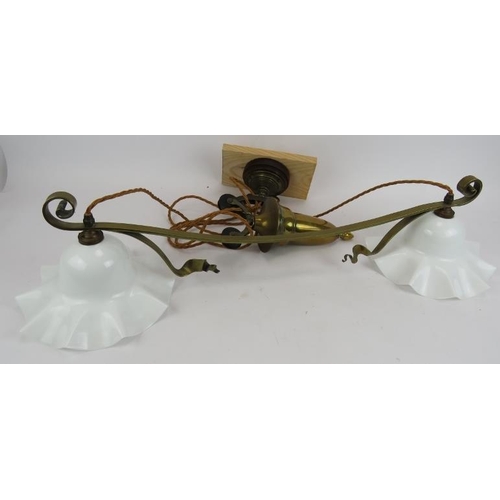 186 - An antique rise and fall parlour ceiling light with brass twin arm lamp, brass weight and original e... 