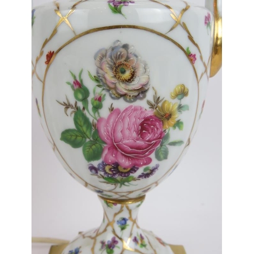 191 - A hand decorated porcelain lamp in the Limoges style mounted on a gilt brass base. Height 34cm.
Cond... 