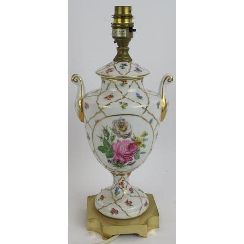 191 - A hand decorated porcelain lamp in the Limoges style mounted on a gilt brass base. Height 34cm.
Cond... 