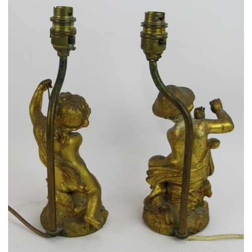 192 - A pair of gilt brass Putti table lamps with shades. Height 29cm. (pr).
Condition report: One with re... 