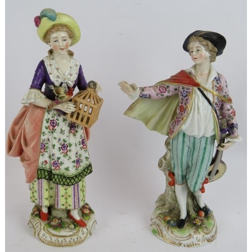 197 - A Sitzendorf porcelain figure of a courting couple, two similar unmarked figures and smaller figure ... 