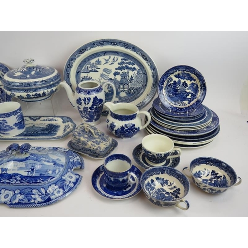 204 - A large quantity of mainly Willow Patter blue and white table ware, various ages and makers. (qty).
... 