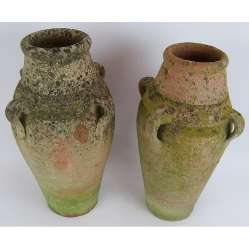 209 - A pair of small antique hand thrown amphoras well weathered. Tallest 43cm. (2).
Condition report: Ch... 