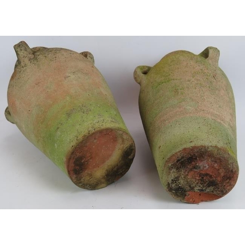 209 - A pair of small antique hand thrown amphoras well weathered. Tallest 43cm. (2).
Condition report: Ch... 