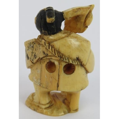 21 - A Japanese Meiji period carved ivory netsuke in the form of a street vendor, signed to base. Height ... 