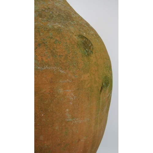 210 - A large antique hand thrown amphora of some considerable age. Height 90cm.
Condition report: One han... 