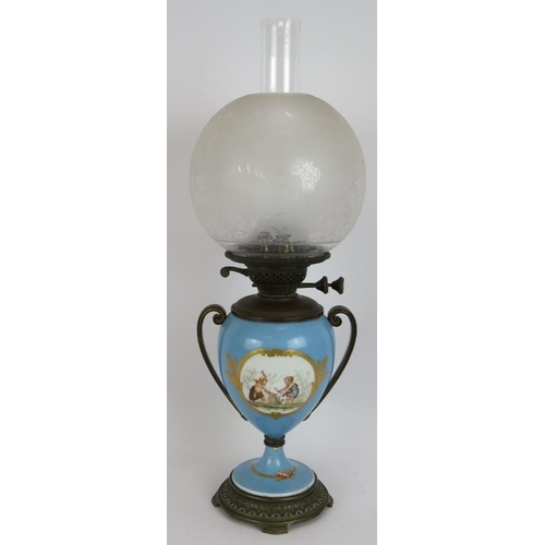 212 - A French porcelain based oil lamp with bronze mounts , an aesthetic style etched glass shade. Height... 