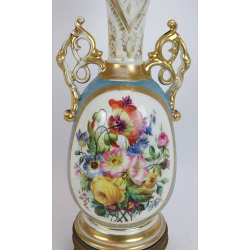 213 - A hand decorated French porcelain lamp with gilt lobes and Ormulu mounts. Height without shade 47cm.... 