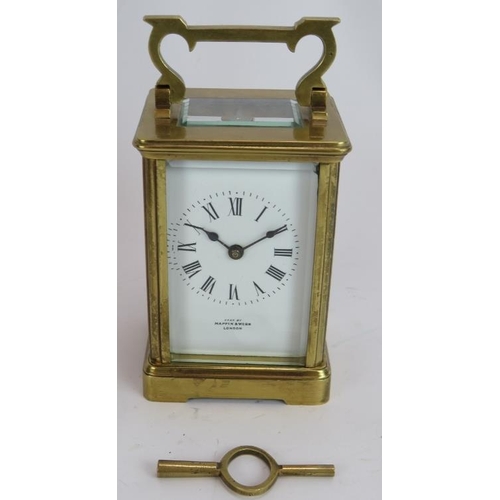 219 - A Mappin and Webb brass cased 8 day carriage clock with carry case and key. Height 15cm.
Condition r... 