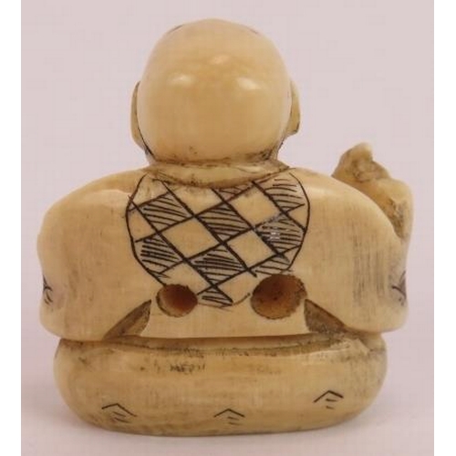 23 - A Japanese Meiji period carved ivory netsuke in the form of a sitting man, signed to base. Height 3.... 