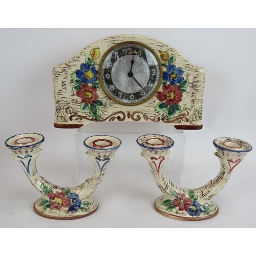 232 - A mid Century West German pottery clock garniture, a mid Century teak candelabra and three vintage s... 