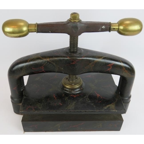 242 - A 19th Century cast iron book press with brass fittings and deeply patinated marbled finish. 51cm x ... 