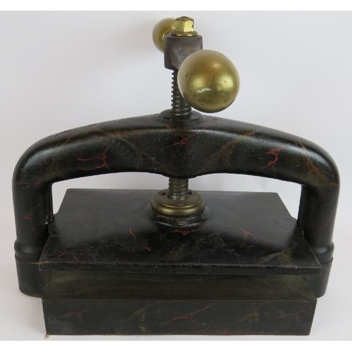 242 - A 19th Century cast iron book press with brass fittings and deeply patinated marbled finish. 51cm x ... 