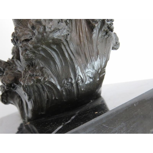 243 - A contemporary bronze figure of Neptune holding a trident mounted on a black marble plinth. Signed B... 