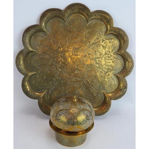 246 - An antique brass Indo Persian tray with scalloped edges and hand chased decoration plus a similar Is... 