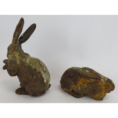 263 - A small pair of antique cast iron figures of hares, each with lead joins. Tallest 19cm.
Condition re... 