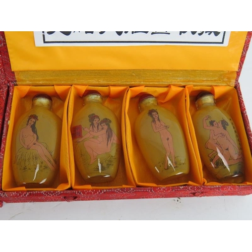 284 - A set of 8 Chinese erotic inside-painted glass snuff bottles, contained within 2 boxes, 20th Century... 