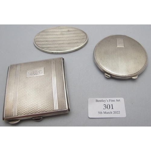 301 - A silver square shaped compact complete with powder puff, engine turned decoration & monogrammed, Bi... 