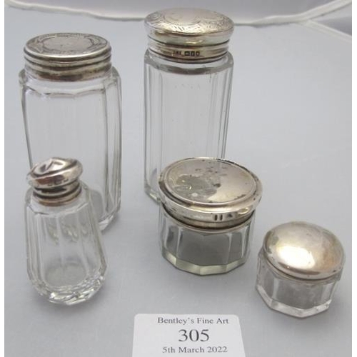 305 - A collection of panel cut jars with silver tops, London 1894, London 1901, Birmingham 1920 & Birming... 