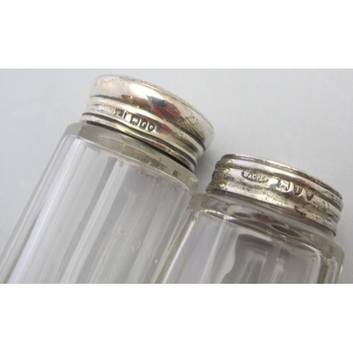 305 - A collection of panel cut jars with silver tops, London 1894, London 1901, Birmingham 1920 & Birming... 