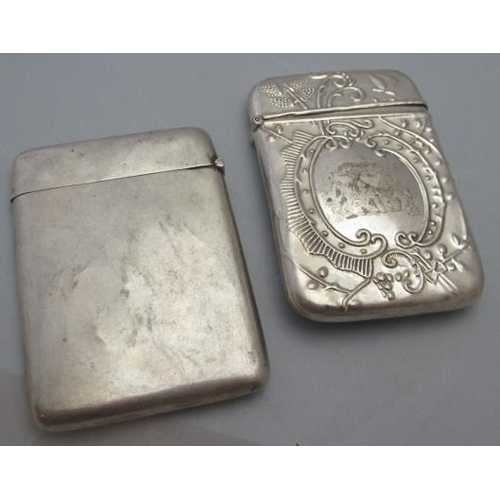 308 - A silver card case with embossed decoration and plain shield shaped cartouche, London 1993 and stamp... 