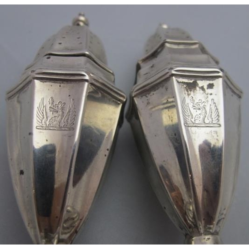 322 - A pair of silver classical shaped peppers, London 1898, engraved with griffin. Approx weight 2.6 tro... 