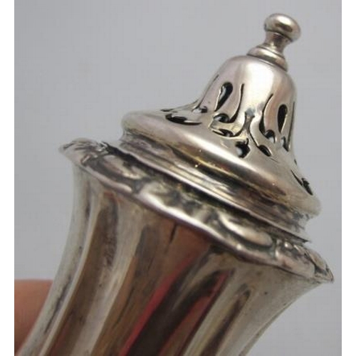 323 - A Victorian silver waisted pedestal pepper, approx 5