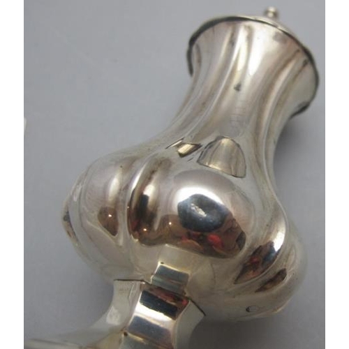 323 - A Victorian silver waisted pedestal pepper, approx 5