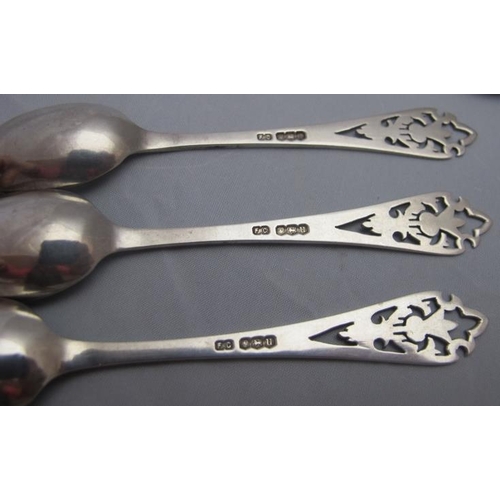 326 - A set of three Frank Cobb silver teaspoons with thistle engraved handles, Sheffield 1937 and a pair ... 