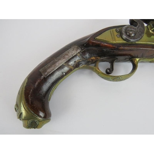 33 - An 18th century flintlock pistol with leopards head butt cap. Length 31cm.
Condition report: Histori... 