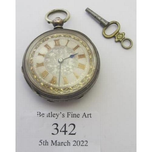 342 - A silver cased pocket watch with engraved decoration and brass numerals with key.
Condition report: ... 