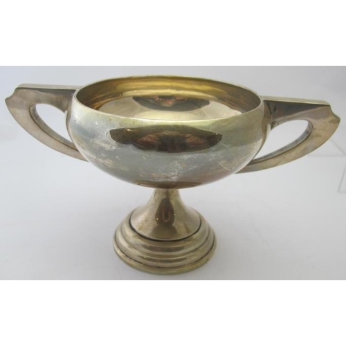 366 - A plain silver two handled trophy, Sheffield 1956. Approx weight 9.7 troy oz/303 grams.
Condition re... 