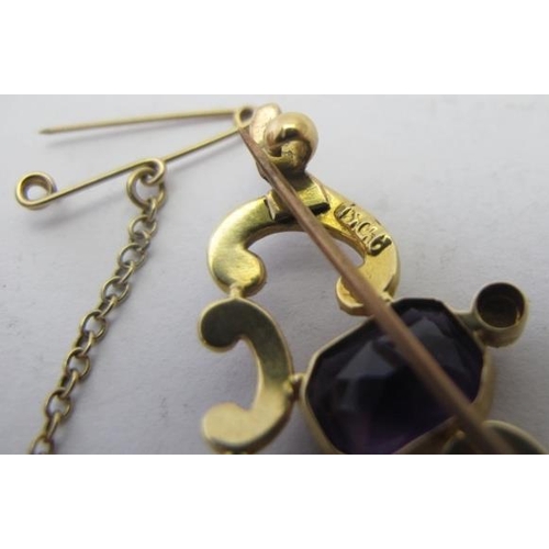 388 - A 15ct yellow gold brooch set with centre amethyst & drop amethyst and with scroll set seed pearls, ... 