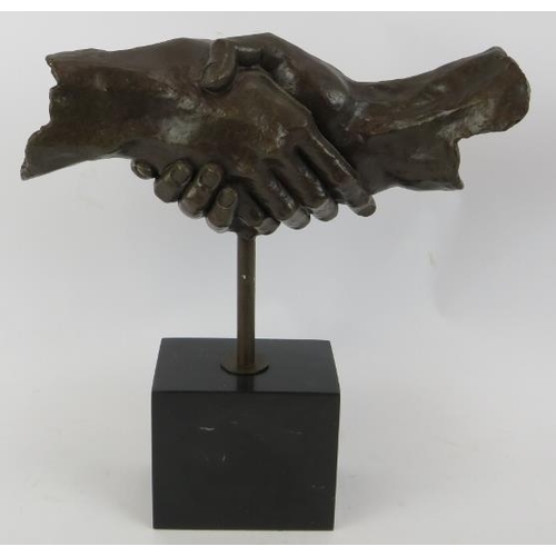 4 - A bronze sculpture of clasped hands mounted on a black marble plinth unsigned. Height 35cm.
Conditio... 