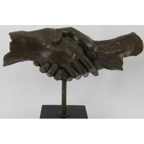 4 - A bronze sculpture of clasped hands mounted on a black marble plinth unsigned. Height 35cm.
Conditio... 